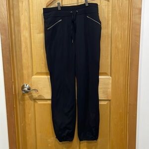 Athleta black joggers pants size S zipper pockets cinchable ankles